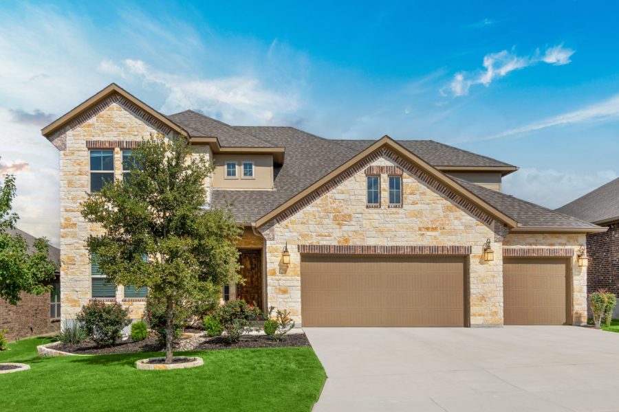 An American home exterior, highlighting essential plumbing warning signs and safety tips from Putman & Son’s Plumbing.