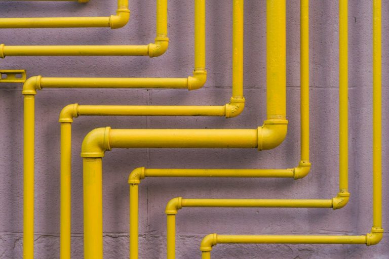 Yellow utility piping illustrating gas line inspection and safety