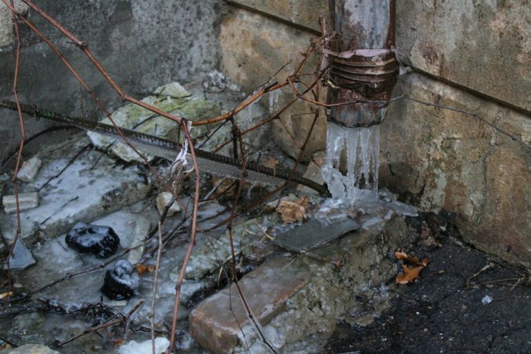 Frozen pipe in cold weather illustrating winter plumbing risks in Michigan